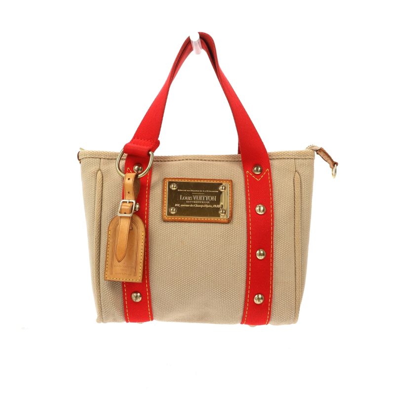 LOUIS VUITTON Handbag in Beige Fabric - Logoexplore