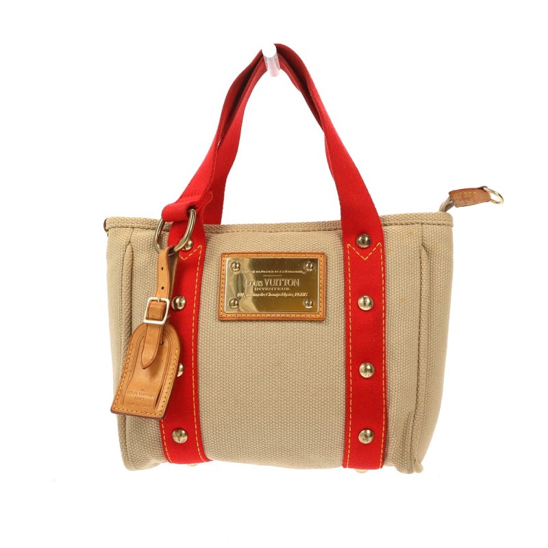 LOUIS VUITTON Handbag in Beige Fabric - Logoexplore